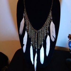 Cream Feather in chain necklace.